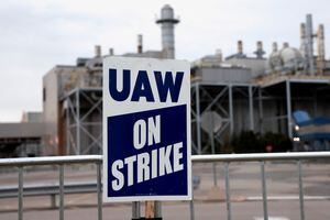 FILE PHOTO: A United Auto Workers On Strike sign is seen outside the Ford Michigan Assembly Plant in Wayne, Michigan U.S. October 25, 2023. REUTERS/Rebecca Cook/File Photo