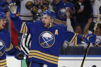 Buffalo Sabres forward Zemgus Girgensons (28) celebrates his goal during the first period of an NHL hockey game against the Montreal Canadiens, Thursday, Oct. 14, 2021, in Buffalo, N.Y.  (AP Photo/Jeffrey T. Barnes)