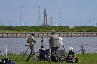 Photographers pack up their equipment as NASA's new moon rocket sits on Launch Pad 39-B after being scrubbed at the Kennedy Space Center,&nbsp;in Cape Canaveral, Fla.,&nbsp;Saturday, Sept. 3, 2022. Canadian astronaut David Saint-Jacques says the scrubbing of the Artemis moon rocket launch today is disappointing, but necessary. THE CANADIAN PRESS/AP-Chris O'Meara