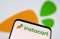 FILE PHOTO: Smartphone with displayed Instacart logo is seen in this illustration taken March 25, 2022. REUTERS/Dado Ruvic/Illustration/File Photo