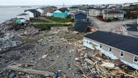 Debris surrounds damaged houses after Hurricane Fiona passed nearby in Port Aux Basques, Newfoundland, Canada September 26, 2022. REUTERS/John Morris
