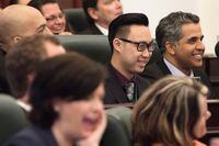 Edmonton-Southwest NDP MLA Thomas Dang, 20, laughs along with his colleagues during an introductory meeting with all newly elected MLAs in Edmonton on Tuesday, May 12, 2015. An Alberta legislature member charged in a computer hacking investigation has pleaded guilty to a charge under the Health Information Act. Thomas Dang, who now sits as an Independent, entered the plea in provincial court Friday, a spokesman for Dang confirmed in a statement. THE CANADIAN PRESS/Amber Bracken