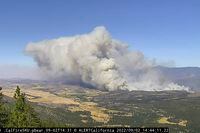 In this image from a Cal Fire monitoring camera from Hammond Ranch, the Mill Fire burns near Weed, Calif., Friday Sept. 2, 2022. (Cal Fire/ALERTWildfire Network via AP)