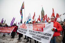 Protestors are seen during a rally to demand Canada's public health care system be protected and expanded, on Parliament Hill in Ottawa, Tuesday, Feb. 7, 2023. THE CANADIAN PRESS/Spencer Colby