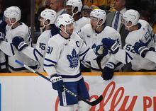 Mar 26, 2023; Nashville, Tennessee, USA; Toronto Maple Leafs center John Tavares (91) celebrates with teammates after a goal during the first period against the Nashville Predators at Bridgestone Arena. Mandatory Credit: Christopher Hanewinckel-USA TODAY Sports