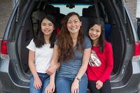Karen Ung and her two daughters Miya and Emi pack their van to go on a summer camping trip in Calgary, Alberta, Canada July 13, 2021.  Todd Korol/The Globe and Mail