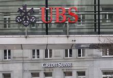 Logos of Swiss banks UBS and Credit Suisse are seen in Zurich, Switzerland March 19, 2023. REUTERS/Moritz Hager