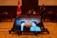 Marc Kielburger, screen left, and Craig Kielburger, screen right, appear as witnesses via videoconference during a House of Commons finance committee in the Wellington Building in Ottawa on Tuesday, July 28, 2020. WE Charity is closing its Canadian operations. The Toronto-based youth organization dropped the bombshell news to its staff this afternoon, with co-founders Craig and Marc Kielburger blaming COVID-19 and the controversy surrounding plans to have it run a federal student-volunteer program. THE CANADIAN PRESS/Sean Kilpatrick