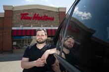 Michael Hendry is photographed outside a Tim Hortons coffee shop in Whitby, Ont.  is photographed on April 12, 2023. (Fred Lum/The Globe and Mail) When Hendry used the Tim Hortons app to roll up the rim, it showed he won a $10 000 prize. The app crashed and after contacting Tom Hortons, it was explained that he didn’t in fact win anything. Later that day, they offered Hendry a $5 gift card instead.
