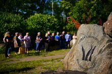 People take part in a vigil at the Women's Monument in Petawawa, Ont., following the juries release of recommendations in the Borutski Inquest in Pembroke, Ont., on Tuesday, June 28, 2022. The inquest, which began June 6, examined the circumstances surrounding the deaths of Carol Culleton, Nathalie Warmerdam and Anastasia Kuzyk, with a focus on the dynamics of gender-based violence, intimate partner violence and femicide in rural communities. The three women were murdered by Basil Borutski in 2015 who was a man who had a known history of violence against women. THE CANADIAN PRESS/Sean Kilpatrick