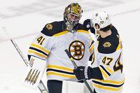 Aug 15, 2020; Toronto, Ontario, CAN; Boston Bruins goaltender Jaroslav Halak (41) smiles as he celebrates their win over the Carolina Hurricanes with defenseman Torey Krug (47) after game three of the first round of the 2020 Stanley Cup Playoffs at Scotiabank Arena. The Boston Bruins won 3-1.Mandatory Credit: John E. Sokolowski-USA TODAY Sports