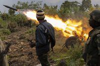 FARDC soldiers fire a rocket from a multiple rocket launcher at M-23 rebels between Rutshuru and Bunagana, Eastern DRC, August 16, 2022.