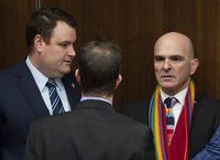 Justice Committee chair Anthony Housefather speaks with Liberal MP Randy Boissonnault, right, and Colin Fraser, left, before a committee meeting in Ottawa, on March 19, 2019.