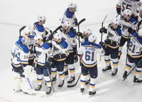 The St. Louis Blues celebrate their win against the Vancouver Canucks, in Edmonton on Aug. 17, 2020.