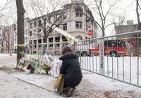 A convicted killer who Quebec police suspect started the fire that killed seven people in Old Montreal last March admits he was at the scene of the arson but claims someone else set the blaze. A woman kneels next to a makeshift memorial at the scene following a fire in Old Montreal, Sunday, March 19, 2023. THE CANADIAN PRESS/Graham Hughes