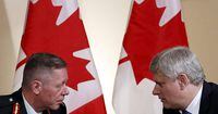 Prime Minister Stephen Harper, right, talks with Lieutenant-General Jonathan Vance in Mr. Harper’s Langevin Block office in Ottawa April 27, 2015.