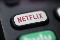 This Aug. 13, 2020, photo shows a logo for Netflix on a remote control in Portland, Ore. Netflix is launching a development program exclusively for diverse Canadian writers in film and television. (AP Photo/Jenny Kane, file)