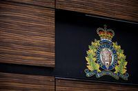 The RCMP logo is seen outside Royal Canadian Mounted Police "E" Division Headquarters, in Surrey, B.C., April 13, 2018. THE CANADIAN PRESS/Darryl Dyck