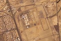 In this satellite photo from Planet Labs PBC, damage is seen after an attack by Yemen's Houthi rebels targeting Saudi Aramco's North Jiddah Bulk Plant in Jiddah, Saudi Arabia, Monday, March 21, 2022. Yemen's Houthi rebels this week struck the exact same oil storage tank in the Saudi Arabian city of Jiddah that they previously hit some two years earlier, satellite photos show. (Planet Labs PBC via AP)