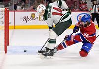 Oct 25, 2022; Montreal, Quebec, CAN; Minnesota Wild forward Joel Eriksson Ek (14) scores a goal and Montreal Canadiens forward Mike Hoffman (68) defends during the third period at the Bell Centre. Mandatory Credit: Eric Bolte-USA TODAY Sports