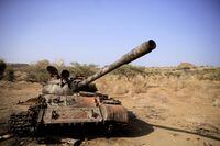FILE PHOTO: A destroyed tank is seen in a field in the aftermath of fighting between the Ethiopian National Defence Force (ENDF) and the Tigray People's Liberation Front (TPLF) forces in Kasagita town, in Afar region, Ethiopia, February 25, 2022. REUTERS/Tiksa Negeri