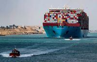 FILE PHOTO: A shipping container passes through the Suez Canal in Suez, Egypt February 15, 2022. Picture taken February 15, 2022. REUTERS/Mohamed Abd El Ghany
