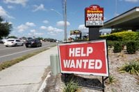 FILE PHOTO: A Brandon Motor Lodge displays a "Help Wanted" sign in Brandon, Florida, U.S., June 1, 2021.  REUTERS/Octavio Jones