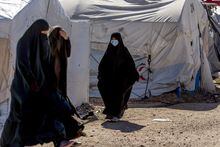 Women walk in Roj detention camp in northeast Syria Wednesday, Feb. 9, 2022. Two Canadian women who were arrested after returning to Canada from a prison camp in northeastern Syria last week are expected to appear in a Brampton, Ont., court today. THE CANADIAN PRESS/AP-Baderkhan Ahmad