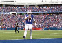 Quarterback Josh Allen of the Buffalo Bills rushes for a touchdown during the fourth quarter of the game against the Washington Football Team at Highmark Stadium on September 26, 2021 in Orchard Park, N.Y.