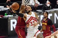Apr 10, 2021; Cleveland, Ohio, USA; Toronto Raptors guard Gary Trent Jr. (33) drives to the basket against Cleveland Cavaliers guard Collin Sexton (2) during the fourth quarter at Rocket Mortgage FieldHouse. Mandatory Credit: Ken Blaze-USA TODAY Sports
