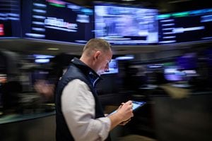 A trader works on the floor at the New York Stock Exchange (NYSE) in New York City, U.S., March 7.
