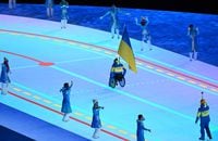 Ukrainian flagbearer Maksym Yarovyi leads the Ukraine delegation in the athlete's parade during the opening ceremony of the Beijing 2022 Winter Paralympic Games at the National Stadium in Beijing on March 4, 2022. (Photo by WANG Zhao / AFP) (Photo by WANG ZHAO/AFP via Getty Images)