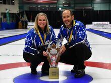 Jennifer Jones and Brent Laing pose with their gold medals and the Canadian Mixed Doubles Curling Championship trophy in Sudbury, Ont., in a March 26, 2023, handout photo. Jones and Laing will represent Canada for the first time at the world mixed doubles championship in an arena that elicits mixed emotions for both. THE CANADIAN PRESS/HO-Curling Canada, Duncan Bell, *MANDATORY CREDIT*