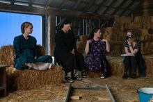 Actors Rooney Mara, left to right, Judith Ivey, Claire Foy and director Sarah Polley talk on the set of their film "Women Talking" in this undated handout photo. THE CANADIAN PRESS/HO, Michael Gibson *MANDATORY CREDIT*
