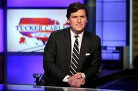 Tucker Carlson, then-host of "Tucker Carlson Tonight," poses for photos in a Fox News Channel studio in New York, March 2, 2017. THE CANADIAN PRESS/AP-Richard Drew