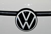 The logo of German car giant Volkswagen (VW) is seen on an ID Buzz van in the showroom during the company's annual press conference to present the business report, on March 14, 2023 in Berlin. - Volkswagen is planning to invest 122 billion euros ($130 billion) in the shift towards electric vehicles over the coming years, as the battle for dominance in the EV market heats up. (Photo by John MACDOUGALL / AFP) (Photo by JOHN MACDOUGALL/AFP via Getty Images)