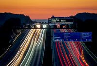 Cars and trucks drive on a highway on the outskirts of Frankfurt, Germany, Saturday, July 2, 2022. (AP Photo/Michael Probst)