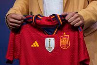 Spain's new women's national team coach Montse Tome holds a jersey during her official presentation at the Spanish soccer federation headquarters in Las Rozas, just outside of Madrid, Spain, Monday, Sept. 18, 2023. Tome replaced Jorge Vilda less than three weeks after Spain won the Women's World Cup title and amid the controversy involving suspended federation president Luis Rubiales who has now resigned. (AP Photo/Manu Fernandez)