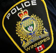 A Winnipeg Police Service shoulder badge is shown on an officer in Winnipeg on Nov. 5, 2019. A Winnipeg man is facing second-degree murder charges after two people died in an apartment fire on Christmas morning. THE CANADIAN PRESS/John Woods