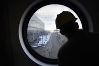 A visitor to the Darlington Nuclear Generating Station in Clarington, Ont. looks out onto the facility grounds during a tour on Feb 11 2016. (Fred Lum/The Globe and Mail)