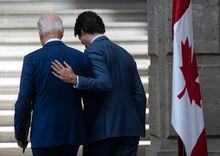 Prime Minister Justin Trudeau puts his hand on United States President Joe Biden as they talk while leaving the joint news conference at the North American Leaders Summit Tuesday, January 10, 2023 in Mexico City, Mexico.  THE CANADIAN PRESS/Adrian Wyld