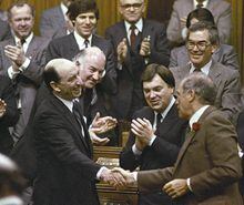 Finance Minister Marc Lalonde is congratulated by Prime Minister Pierre Trudeau at the end of Lalonde's budget speech in the House of Commons in Ottawa on April 19, 1983. Prime Minister Justin Trudeau has confirmed that former federal Liberal minister Marc Lalonde has died at age 93. THE CANADIAN PRESS/Chuck Mitchell