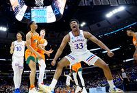 Mar 27, 2022; Chicago, IL, USA; Kansas Jayhawks forward David McCormack (33) reacts after a play during the second half against the Miami Hurricanes in the finals of the Midwest regional of the men's college basketball NCAA Tournament at United Center. Mandatory Credit: David Banks-USA TODAY Sports