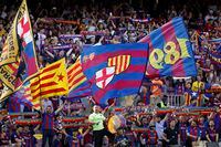 Barcelona fans bang drums, wave flags and chant before a Spanish La Liga soccer match between Barcelona and Mallorca at the Camp Nou stadium in Barcelona, Spain, Sunday, May 28.