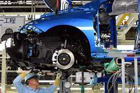 (FILES) An employee of Toyota Motors assembles FCV "Mirai" on its assembly line during the vehicle's line off ceremony at the Motomachi factory in Toyota city, Aichi prefecture on February 24, 2015. Toyota said on August 29, 2023 it halted operations at 12 of its 14 factories in Japan due to a system glitch, but that it did not appear to be a cyberattack. (Photo by Toshifumi KITAMURA / AFP) (Photo by TOSHIFUMI KITAMURA/AFP via Getty Images)