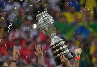 Brazilian players raise the trophy after winning the Copa America, at Maracana Stadium, in Rio de Janeiro, on July 7, 2019.
