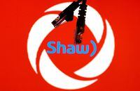 FILE PHOTO: Ethernet cables are seen in front of Rogers and Shaw Communications logos in this illustration taken, July 8, 2022. REUTERS/Dado Ruvic/Illustrations/File Photo