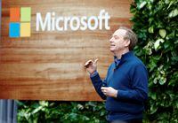 President of Microsoft Brad Smith speaks in front of a Microsoft logo as the company announces plans to be carbon negative by 2030 and to negate all the direct carbon emissions ever made by the company by 2050 at their campus in Redmond, Washington, U.S., January 16, 2020. REUTERS/Lindsey Wasson