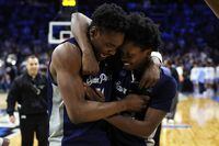 PHILADELPHIA, PENNSYLVANIA - MARCH 25: KC Ndefo #11 and Jaylen Murray #32 of the St. Peter's Peacocks celebrate after defeating the Purdue Boilermakers 67-64 in the Sweet Sixteen round game of the 2022 NCAA Men's Basketball Tournament at Wells Fargo Center on March 25, 2022 in Philadelphia, Pennsylvania. (Photo by Patrick Smith/Getty Images)