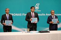 Petronas President and Group CEO Tengku Muhammad Taufik Tengku Aziz holding financial results report poses for a picture after a news conference in Kuala Lumpur, Malaysia September 4, 2020. REUTERS/Lim Huey Teng